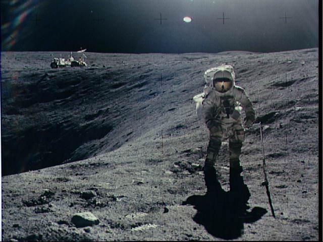 Apollo 16 Astronaut Charlie Duke exploring Plum Crater on the Moon