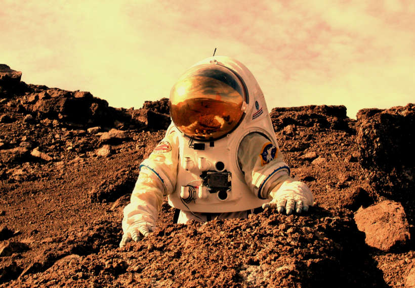 Image of an astronaut on Mars. Photo credit: NASA Haughton-Mars Project/Pascal Lee 010808-0013.