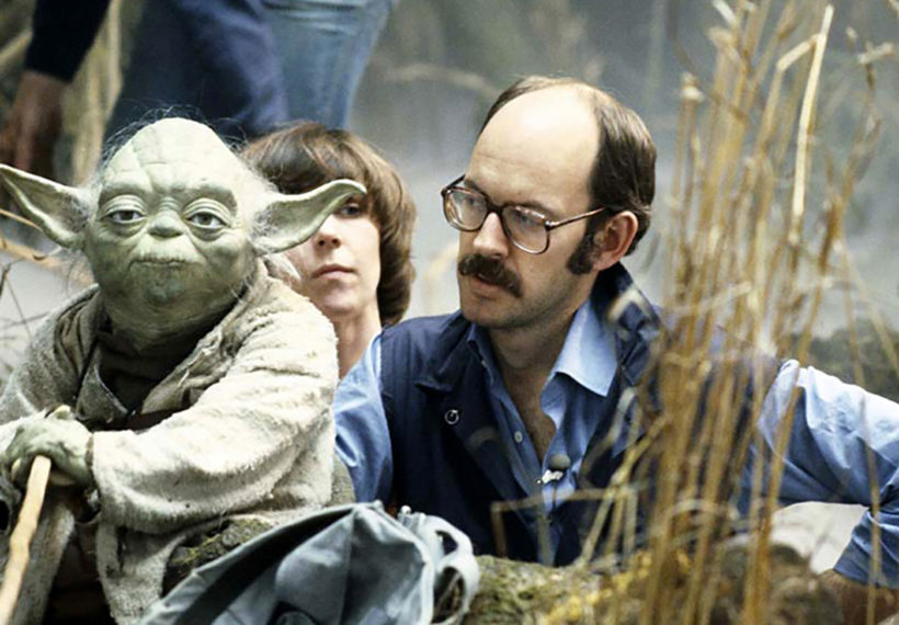 Photo of Yoda, Kathryn Mullen and Frank Oz on the set of "The Empire Strikes Back", via muppet.wikia.com [CC BY-SA 3.0 (https://creativecommons.org/licenses/by-sa/3.0).