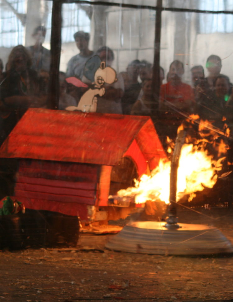 Robot combat involving a flame-enabled robot (left) and a "shredder" robot (right).