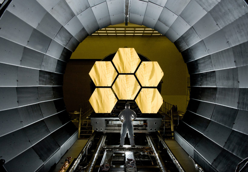 NASA engineer Ernie Wright looks on as the first six flight ready James Webb Space Telescope's primary mirror segments are prepped to begin final cryogenic testing at NASA's Marshall Space Flight Center.